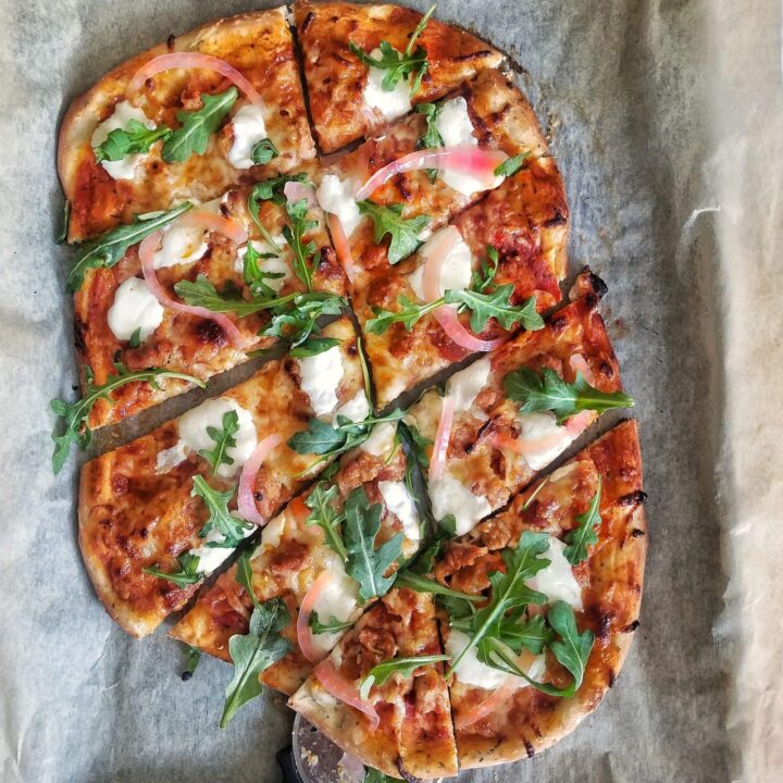 Italian Sausage and Pepperoni Pizza with Pickled Onions and Arugula