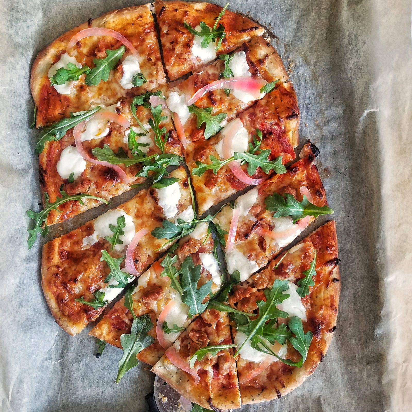 Italian Sausage and Pepperoni Pizza with Pickled Onions and Arugula