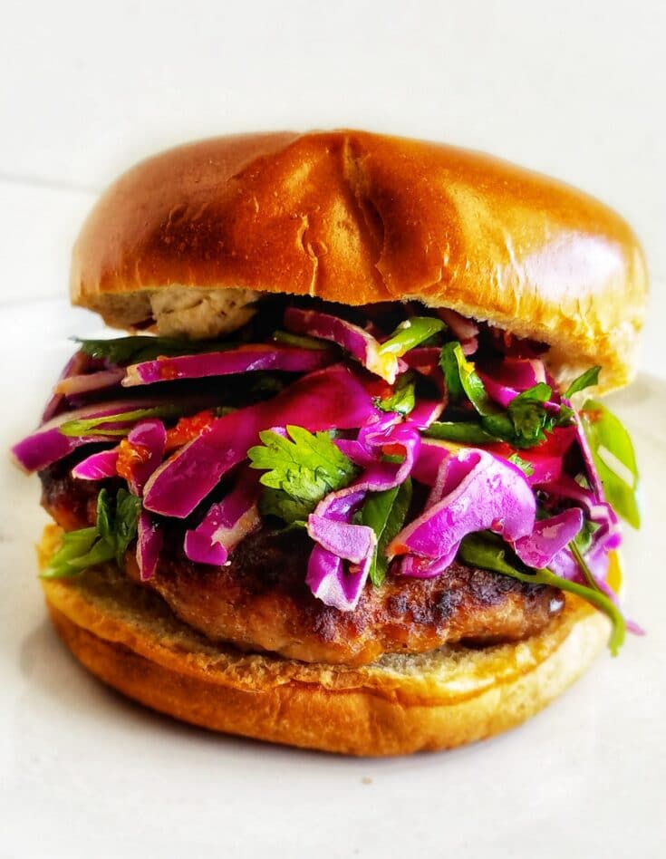 Sweet and spicy pork burgers with red cabbage slaw