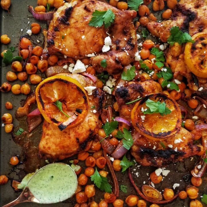 sheet pan chicken thighs with chickpeas and herby yogurt sauce recipe found on mandyolive.com