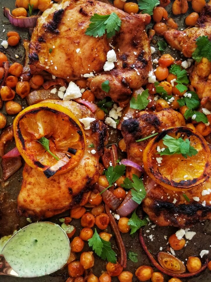 sheet pan chicken thighs with chickpeas and herby yogurt sauce recipe found on mandyolive.com