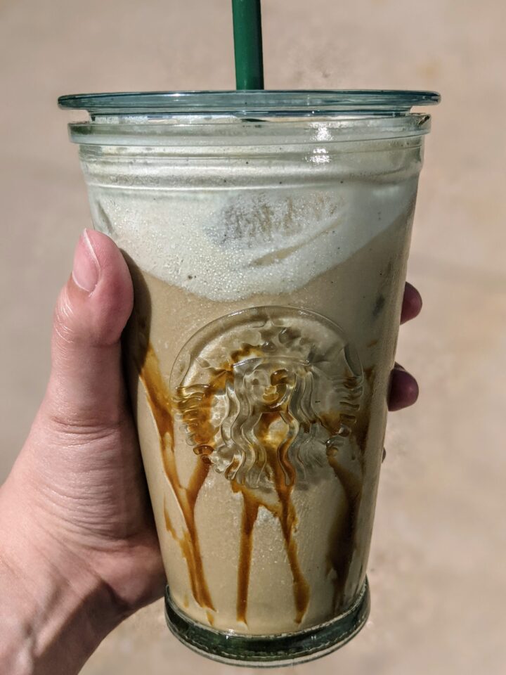 Salted caramel cream nitro cold brew starbucks copycat recipe in a starbucks cold cup with caramel drizzle and vanilla sweet cream.