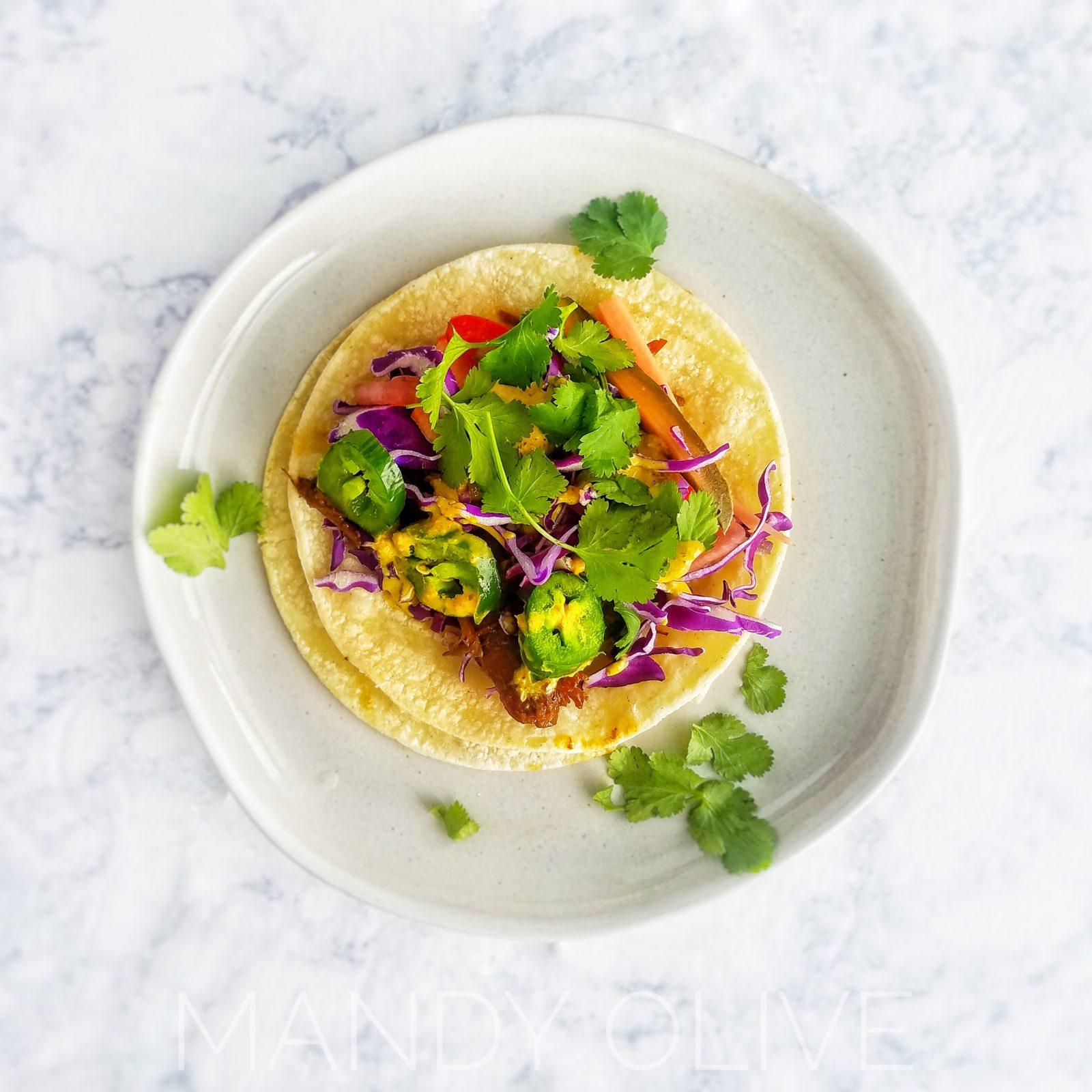 These easy banh mi pork taco recipe is vietnamese street food made right in your crockpot. topped with quick pickled vegetables perfect for meal planning, meal prep, lunch, dinner, meal ideas. Easy marinade, healthy. inspired by banh mi sandwich. pulled pork made in your slow cooker.