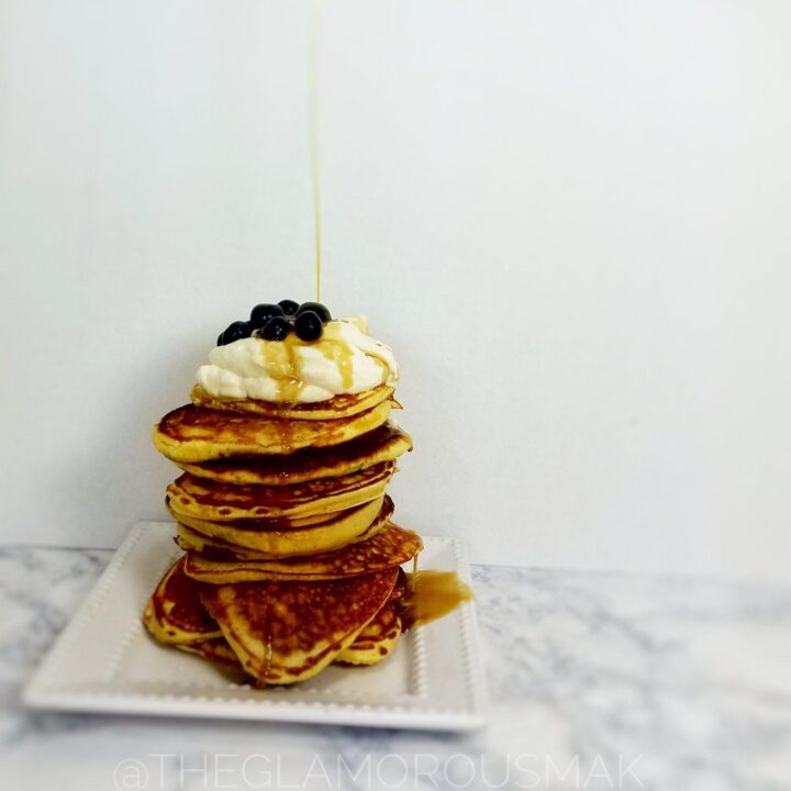 Give your mornings and interesting twist with these fluffy lemon pancakes with blueberries, ricotta and almond flour. This blueberry pancake recipe is easy to make from scratch. Simply serve with maple syrup or maple whipped cream to amp up your breakfast.