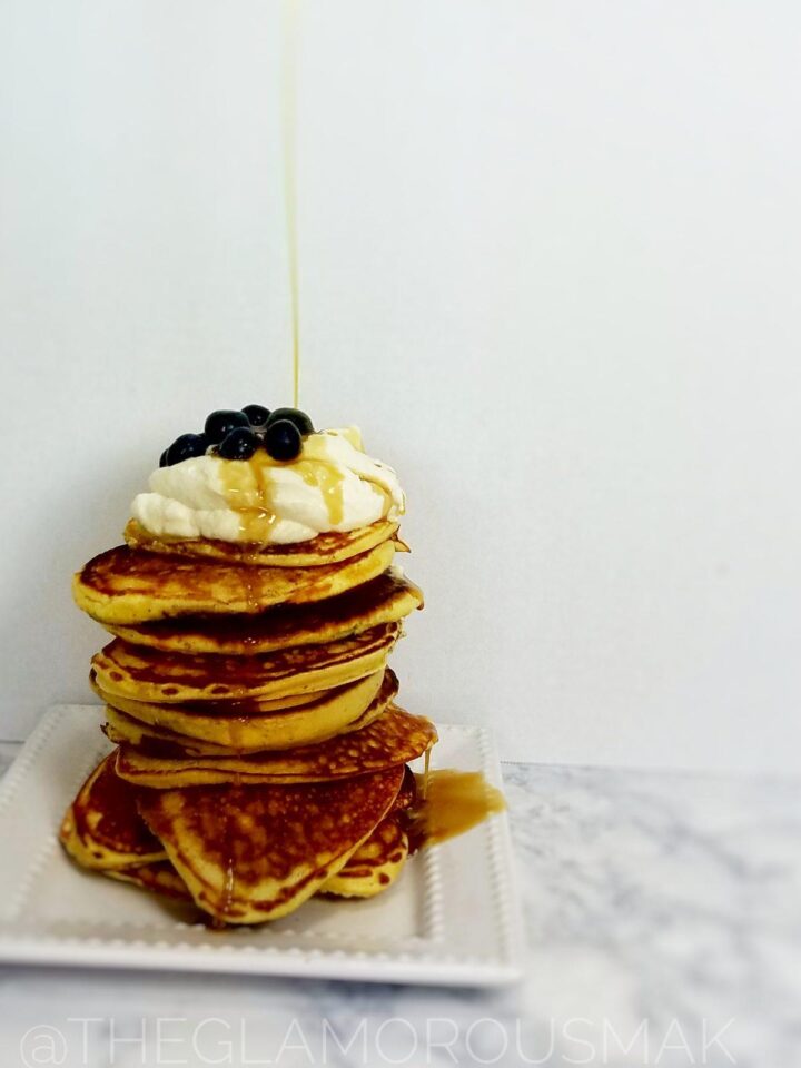 Give your mornings and interesting twist with these fluffy lemon pancakes with blueberries, ricotta and almond flour. This blueberry pancake recipe is easy to make from scratch. Simply serve with maple syrup or maple whipped cream to amp up your breakfast.