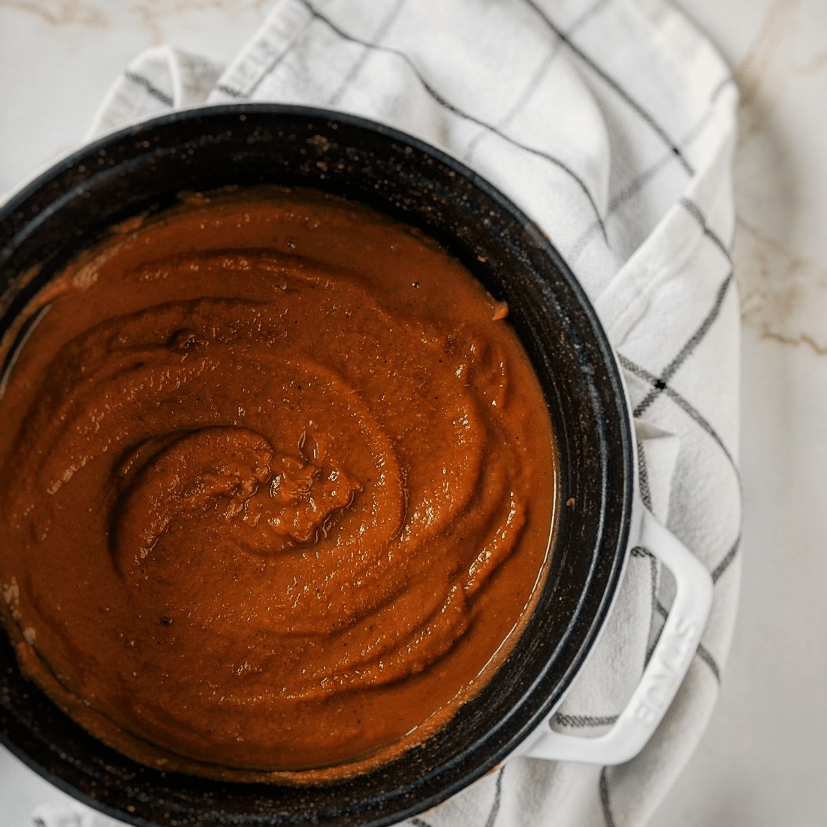 Pumpkin and butternut squash pureed in staub dutch oven. recipe found on mandyolive.com