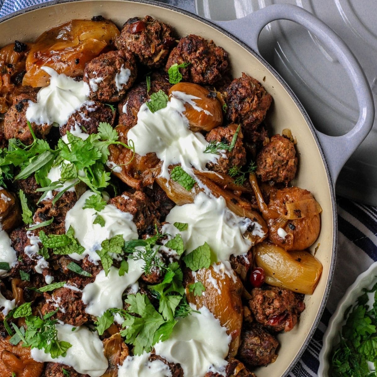 meatballs and potatoes in braiser pan