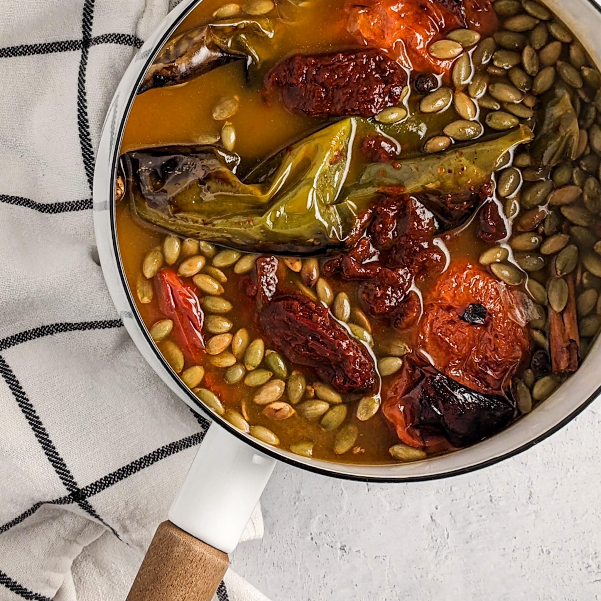 smoky pepita mole in white pot before blending