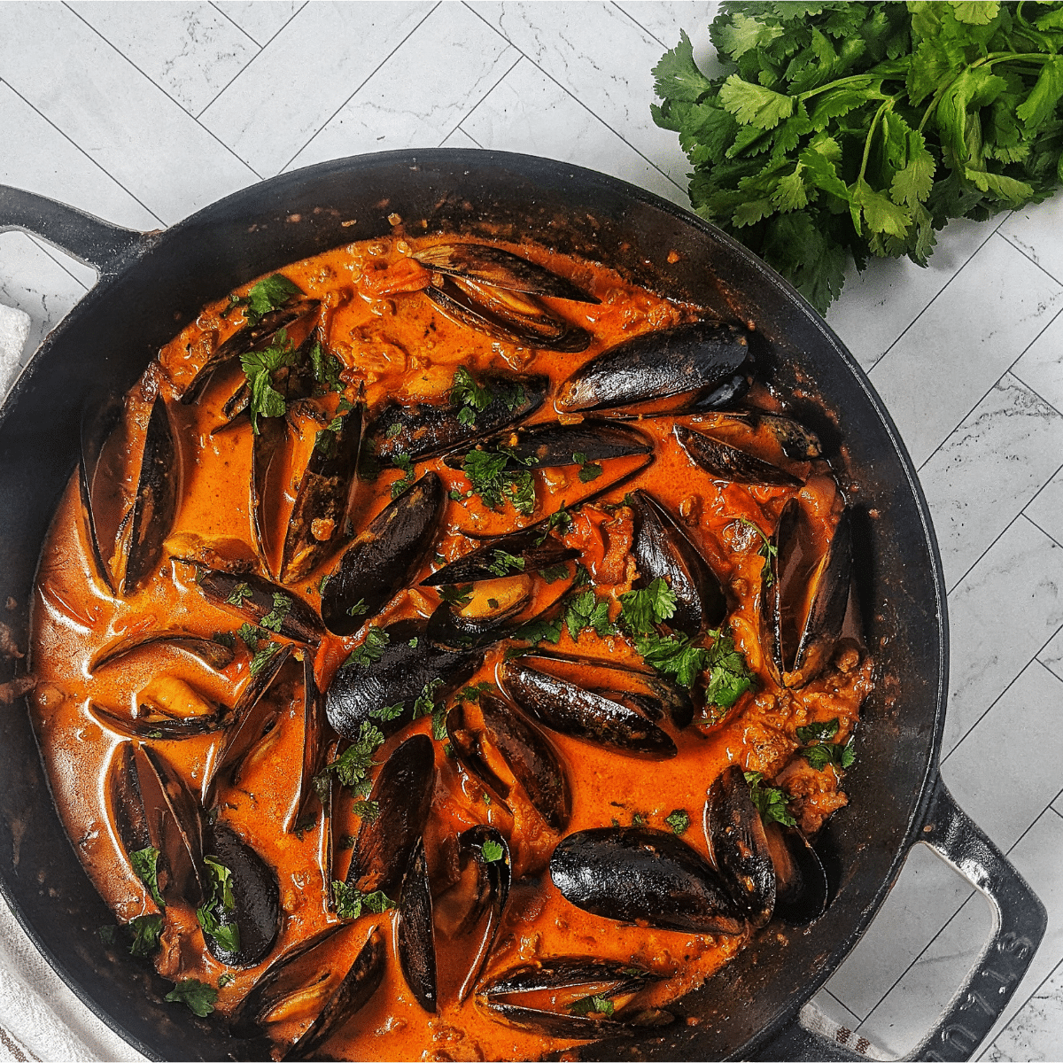 steamed mussels in tomato sauce and chorizo